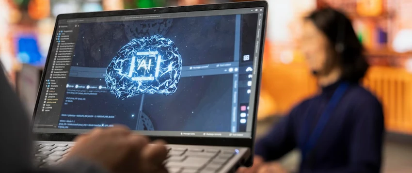 Learner using AI tools on a laptop to build practical artificial intelligence skills