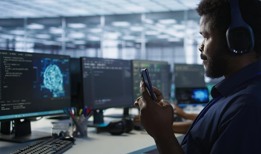 Professionals using AI tools and digital screens to build practical artificial intelligence skills