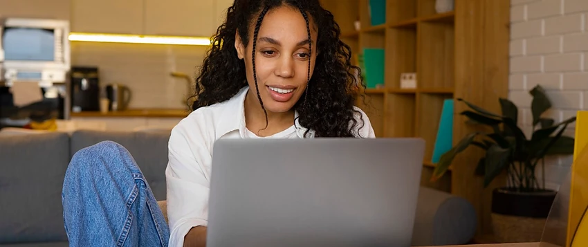 Working professional studying an Advanced Certificate in Business Management online