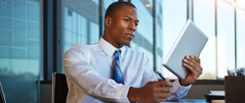 Public management professional reviewing documents in a modern office