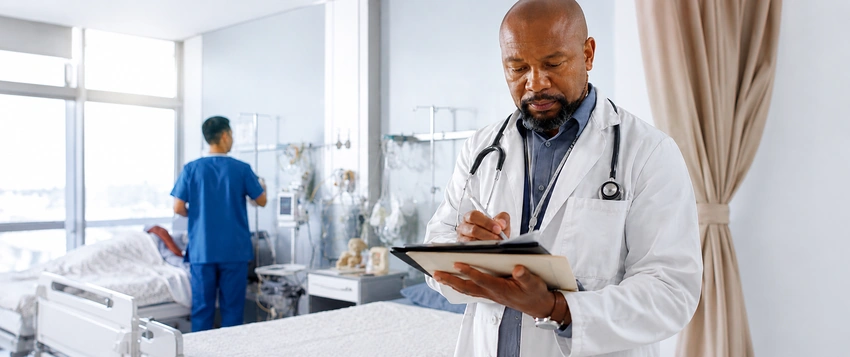 Doctor using digital health in 2026 to review patient information in a hospital