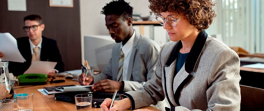 Public management professionals completing administrative work in a government office