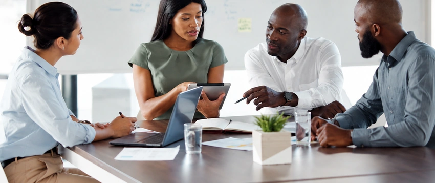 African professionals using project management skills during a planning meeting