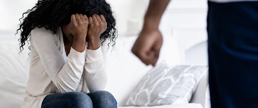 Woman experiencing emotional distress in a situation linked to gender-based violence and coercive control