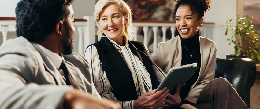Family law professionals discussing legal matters with a client during a consultation