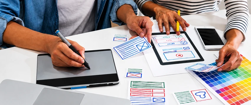 Interaction designers creating wireframes and planning a digital user experience