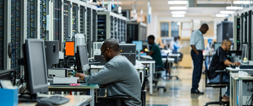 IT professionals working with network infrastructure in a modern data centre