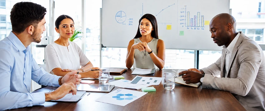 Business professionals discussing strategy and management during a team meeting
