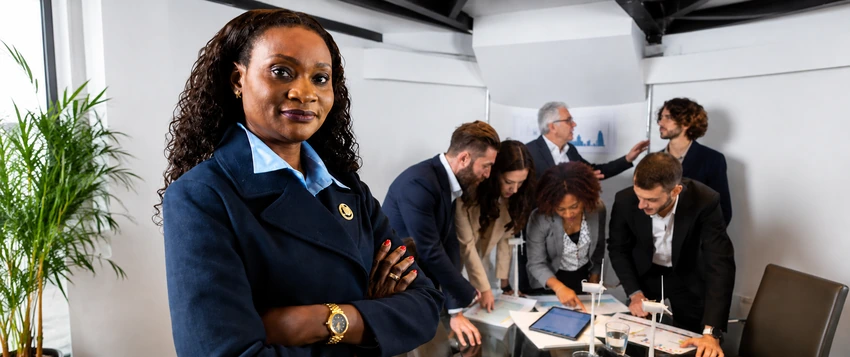 Public administration professional leading a team during a strategic workplace meeting