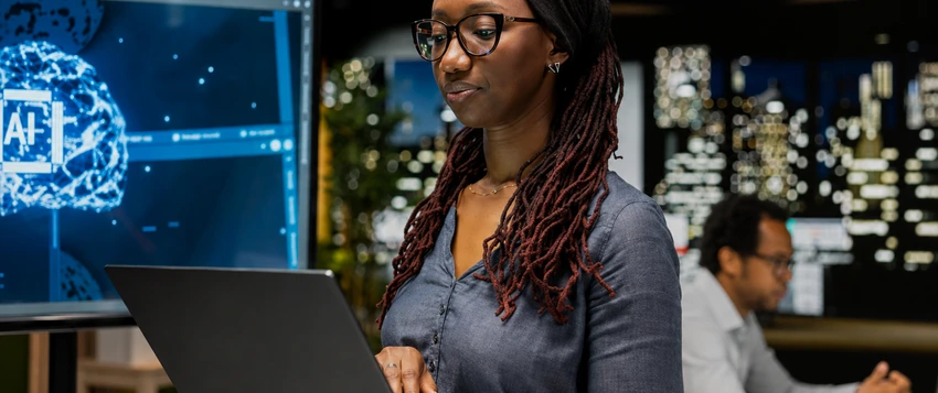 Woman in tech working with artificial intelligence and data analytics in a modern office