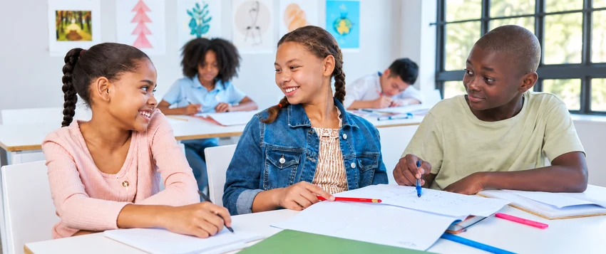 African students collaborating in a classroom while learning and sharing ideas