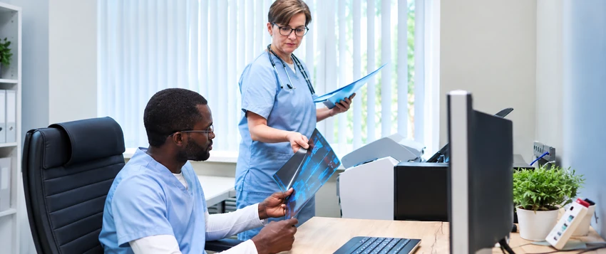 Healthcare professionals reviewing medical information for career development