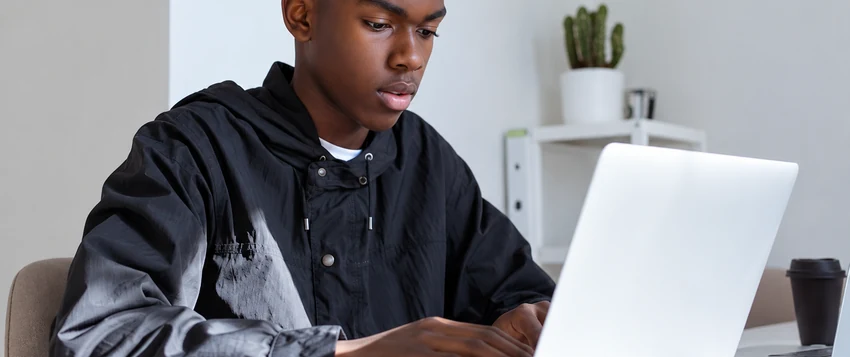 Young South African learner studying IT on a laptop as a pathway to further education